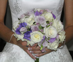 Soft, romantic lissianthus, roses, and sweet peas