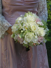 Delicate lacy roses, phlox, ivy, and hydrangea