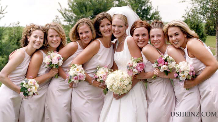 Happy bride with attendants and their bouquets