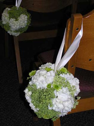 A pomander sphere makes an unique aisle decoration